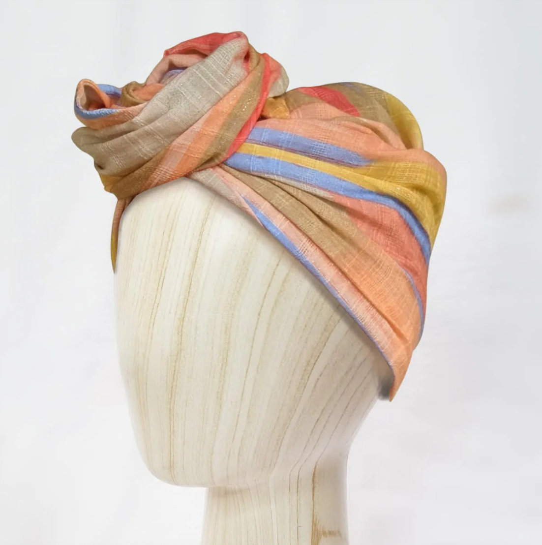 wired head wrap, headwrap and turban thats easy to tie placed on the head of a maniquin