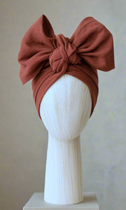 Twisted style with Celine Martine Josephine Head Wrap in Rust perfect for versatile, everyday hair styling