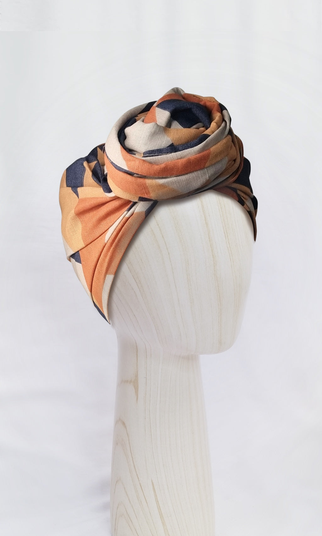 Celine Martine Josephine Geo Nautic with extra-length head wrap in cotton-linen fabric, styled with a central front knot. Features signature geometric pattern and offers endless styling options.