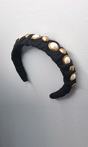 Another angle of the Meet Cute As A Button headband, showcasing its elegant design for effortless styling, with or without hair loss