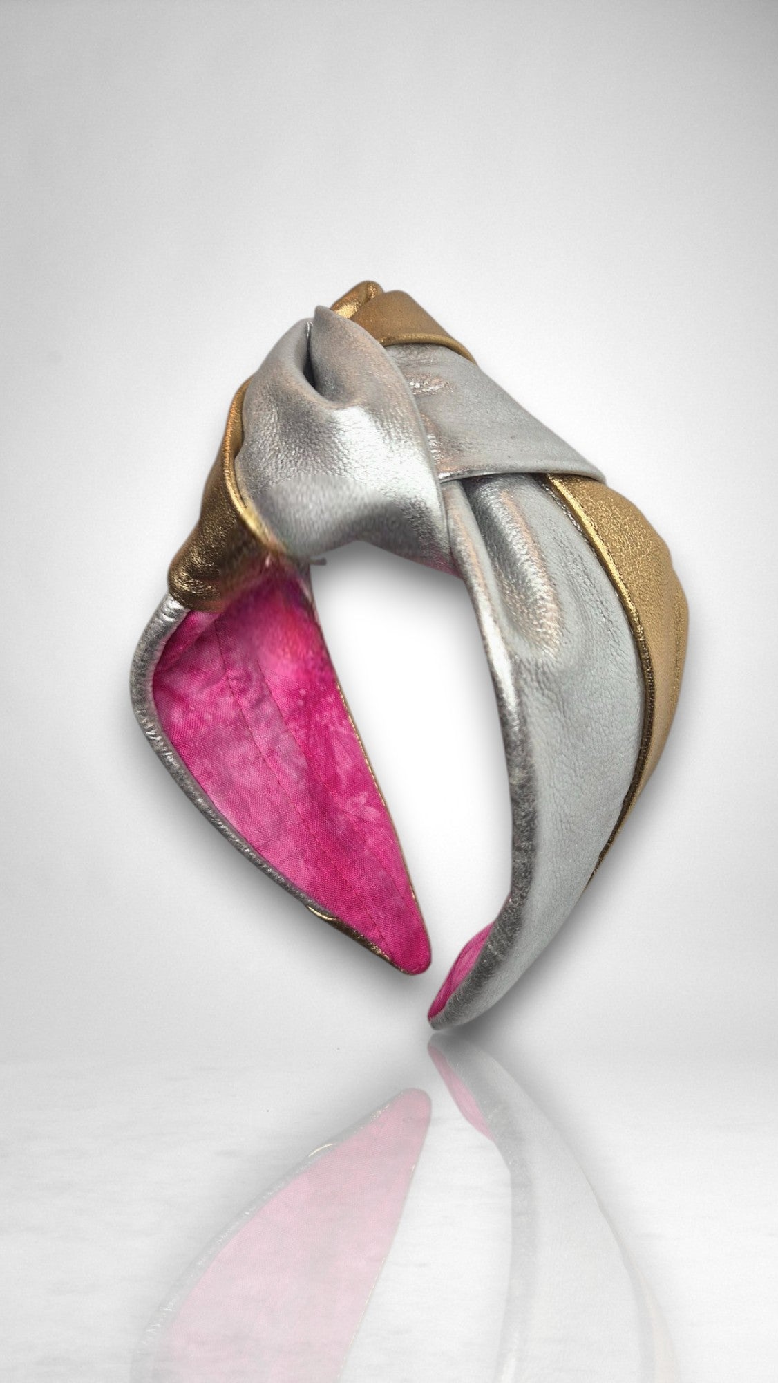Side view of Celine Martine’s Simone Headband featuring a soft metallic leather knot and no-pinch band for all-day comfort