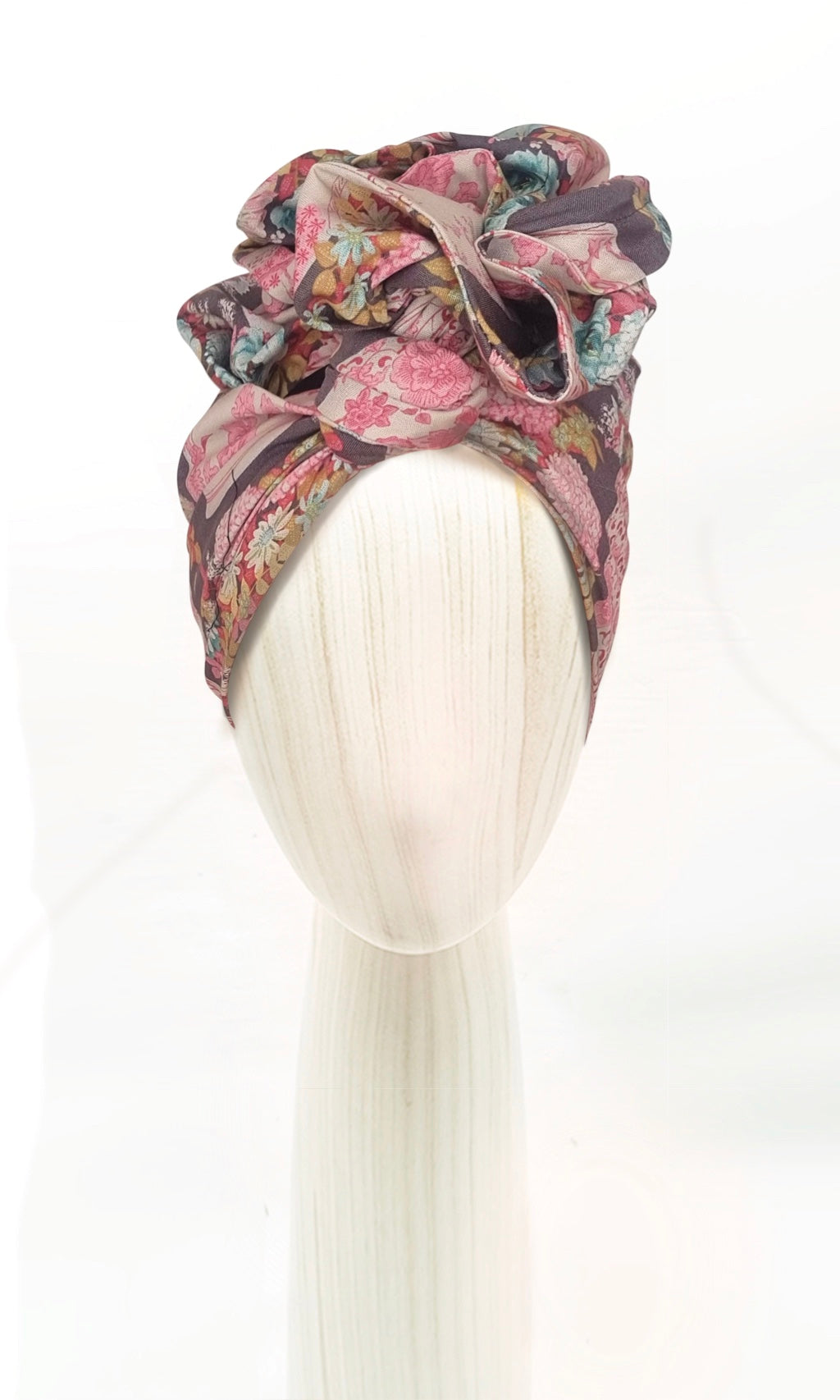 The Celine Martine wired head wrap in Flowervae grey displayed on a mannequin head styled in one of several hair scarf options